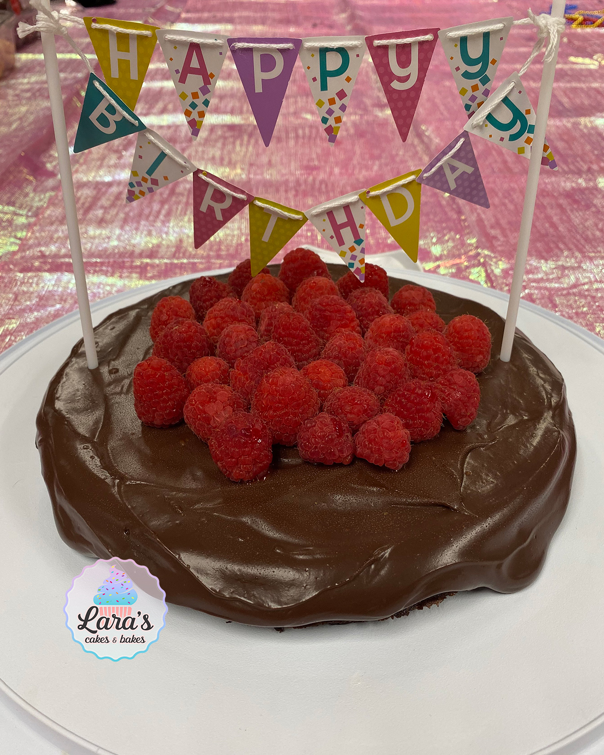 Flourless chocolate cake with ganache and raspberries