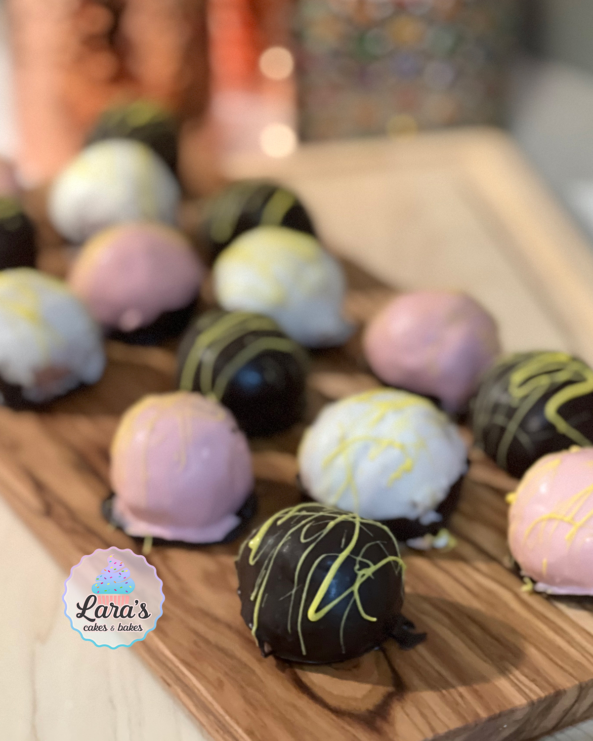 Strawberry cake truffles with decorative chocolate
