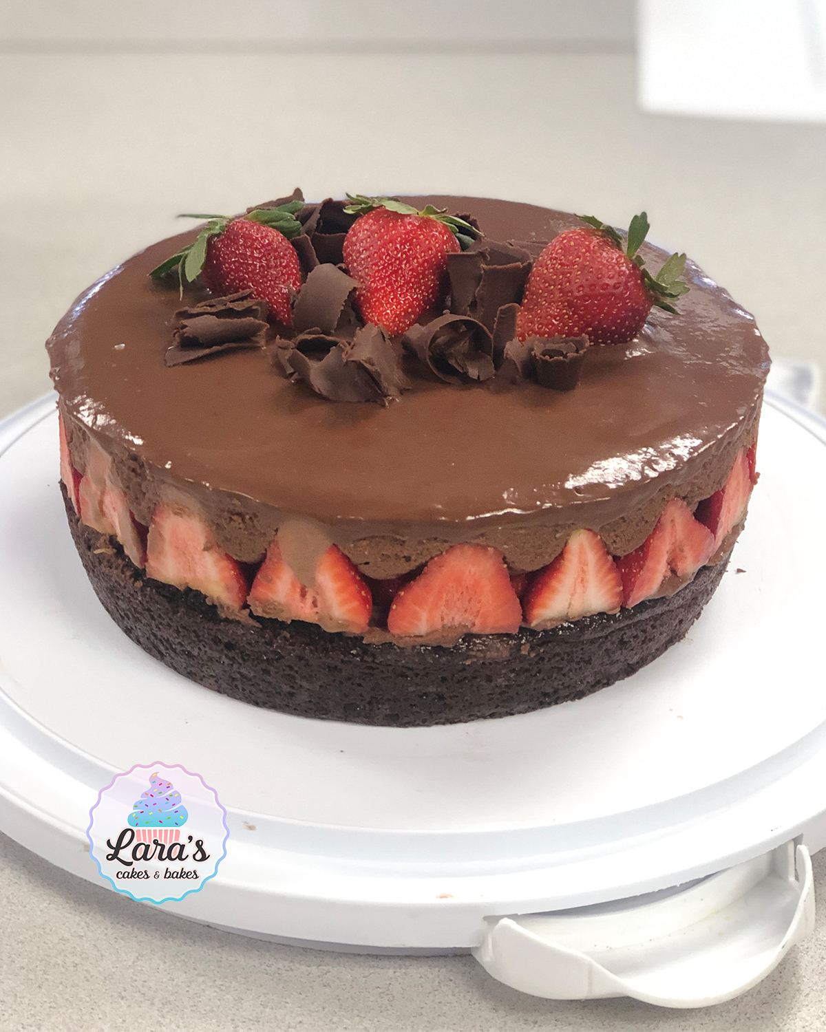 Chocolate cake with strawberries and chocolate ganache